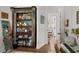 Decorated bookshelf featuring unique decor and open shelving adds charm to this office space at 645 Manor Rd, Maitland, FL 32751