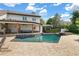 The outdoor area featuring a pool with a spa and a covered patio with comfortable seating at 645 Manor Rd, Maitland, FL 32751