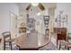 Large dining room with a view into the living room; decorated with decorative artwork at 682 Lexington Dr, Clermont, FL 34711