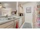 Functional kitchen with tile flooring and ample cabinet space, offering a view into the living area at 682 Lexington Dr, Clermont, FL 34711