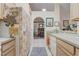 Open-concept kitchen with tile flooring, offering a view to the dining room and stylish refrigerator at 682 Lexington Dr, Clermont, FL 34711