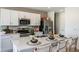 Contemporary kitchen with stainless steel appliances and ample counter space at 7335 Capstone Dr, Groveland, FL 34736
