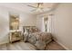 Cozy bedroom features a paisley-patterned bed set and hardwood floors at 7420 Cypress Grove Rd # 132, Orlando, FL 32819
