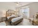 Bedroom has a queen bed, decorative pillows, bedside tables and an exterior view at 7420 Cypress Grove Rd # 132, Orlando, FL 32819