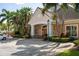 Charming clubhouse entrance with well-maintained landscaping and convenient parking at 7420 Cypress Grove Rd # 132, Orlando, FL 32819