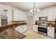 Kitchen features stainless steel appliances, granite countertops, and white cabinets at 7420 Cypress Grove Rd # 132, Orlando, FL 32819