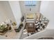 Bright living room features high ceilings, fireplace, and large windows with water views at 7420 Cypress Grove Rd # 132, Orlando, FL 32819