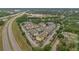 Aerial view of community near the highway featuring multiple apartment buildings and mature trees at 8213 Claire Ann Dr # 108, Orlando, FL 32825