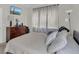 Calm bedroom featuring large window and a wall-mounted TV at 8213 Claire Ann Dr # 108, Orlando, FL 32825