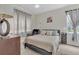 Comfortable bedroom featuring modern decor and large windows at 8213 Claire Ann Dr # 108, Orlando, FL 32825
