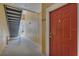 Exterior entryway featuring a bright red door and stairs at 8213 Claire Ann Dr # 108, Orlando, FL 32825