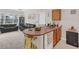 Kitchen and living room combo featuring a counter with sink at 8213 Claire Ann Dr # 108, Orlando, FL 32825