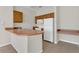 Efficient kitchen with stainless steel appliances, ample countertop space, and wood cabinetry at 8213 Claire Ann Dr # 108, Orlando, FL 32825