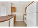 Functional kitchen featuring wood cabinets, a stainless steel sink, and modern appliances at 8213 Claire Ann Dr # 108, Orlando, FL 32825