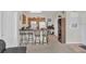 Open kitchen and living area with a counter and room for seating at 8213 Claire Ann Dr # 108, Orlando, FL 32825