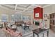 Elegant living room showcasing coffered ceilings, a stone fireplace, and sophisticated decor at 8213 Claire Ann Dr # 108, Orlando, FL 32825