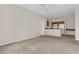 Open floor plan combining the living room and kitchen with sleek appliances and ample counter space at 8213 Claire Ann Dr # 108, Orlando, FL 32825