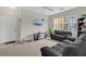 Living room with neutral carpet and a large window for ample natural light at 8213 Claire Ann Dr # 108, Orlando, FL 32825