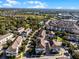 Scenic aerial view of residential homes nestled among lush greenery near a serene lake, highlighting neighborhood layout at 861 Taramundi Dr, Oviedo, FL 32765
