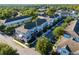 Beautiful aerial view of a colorful townhouse community featuring landscaping and street parking at 861 Taramundi Dr, Oviedo, FL 32765