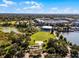 Expansive aerial view featuring green space, a pond, and a gazebo, showcasing community amenities and open recreational area at 861 Taramundi Dr, Oviedo, FL 32765