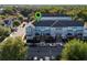 Aerial view of townhouses, lush landscaping, street parking, and green location pin at 861 Taramundi Dr, Oviedo, FL 32765