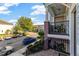 Charming townhome balcony overlooking a tree-lined street, enhanced with decorative plants at 861 Taramundi Dr, Oviedo, FL 32765