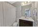 Modern bathroom with shower and dark wood vanity at 861 Taramundi Dr, Oviedo, FL 32765
