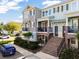 Inviting townhome exterior showcasing brick accents, front balconies, and well-maintained landscaping at 861 Taramundi Dr, Oviedo, FL 32765