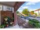 Front porch with brick archway leading to stairs, plants in pots, and wrought-iron railing at 861 Taramundi Dr, Oviedo, FL 32765