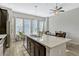 Contemporary kitchen featuring a large island with seating, modern appliances, and plenty of natural light at 861 Taramundi Dr, Oviedo, FL 32765