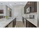 Modern kitchen with stainless steel appliances, and a spacious island with breakfast bar at 861 Taramundi Dr, Oviedo, FL 32765