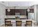 Well-appointed kitchen with stainless steel appliances, quartz countertops, and a large island at 861 Taramundi Dr, Oviedo, FL 32765
