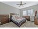 Comfortable carpeted main bedroom with ceiling fan and an abundance of natural light at 861 Taramundi Dr, Oviedo, FL 32765