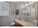 Charming bathroom features a granite countertop, a large mirror, and a shower with a curtain at 9126 Shadowbrook Trl, Orlando, FL 32825