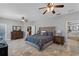 Large main bedroom with tile floors, modern decor, and an en-suite bathroom at 9126 Shadowbrook Trl, Orlando, FL 32825