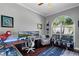 Inviting home office with a large window, custom built-ins, and a modern, sleek design at 9126 Shadowbrook Trl, Orlando, FL 32825