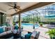 Inviting screened-in pool area with an outdoor lounge and lush landscaping at 9126 Shadowbrook Trl, Orlando, FL 32825