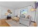 Bright living room featuring a comfortable sectional sofa and natural light at 715 Braidwood Ln, Orlando, FL 32803
