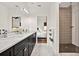 Bathroom features a double sink vanity and a peek at the walk-in shower at 10452 Log House Rd, Clermont, FL 34711