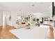 Bright and airy living room with hardwood floors, white furnishings and lots of natural light at 10452 Log House Rd, Clermont, FL 34711
