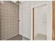 Modern walk-in shower has glass enclosure and decorative tile at 10452 Log House Rd, Clermont, FL 34711