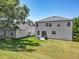 Expansive backyard features a well-maintained lawn, complementing the home's exterior at 1225 Greenley Ave, Groveland, FL 34736
