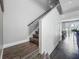 Staircase leading to an open living area and backyard view at 1225 Greenley Ave, Groveland, FL 34736