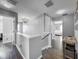 Hallway showcasing chandelier and wood-look floors at 1225 Greenley Ave, Groveland, FL 34736