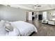 Spacious main bedroom with tray ceilings, lots of natural light, and ensuite bath at 1225 Greenley Ave, Groveland, FL 34736