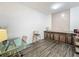 Bright dining area featuring wood-look flooring and updated cabinets at 1225 Greenley Ave, Groveland, FL 34736