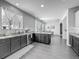 Stylish kitchen with dark wood cabinets, granite countertops, and an open layout at 1225 Greenley Ave, Groveland, FL 34736