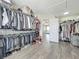 Spacious walk-in closet with ample shelving and racks for organization of clothes and shoes at 1225 Greenley Ave, Groveland, FL 34736