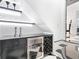 Basement with a chic bar, wine storage, and modern design at 1581 Forest Ave, Winter Park, FL 32789